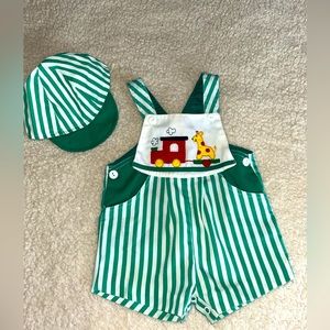 Vintage green and white sunsuit with train and giraffe appliqué and cap. EUC 18M